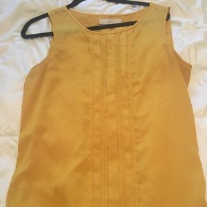 Mustard yellow pin tucked sleeveless top